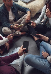 group of people addicted having fun together using smart phones