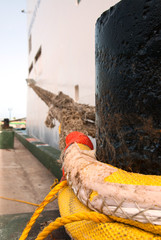 Cruise ship fixed with a strong rope on a bollard in the port of Nassau, Bahamas.