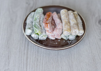 Traditional Turkish Delight. Oriental dessert on a  plate. Isolated on background. Eastern delicacy sweets. Healthy food mix assortment. Collection of different for image close up top view