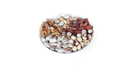 Healthy food. Nuts mix assortment on white grey table top view. Collection of different legumes for background image close up nuts, pistachios, almond, cashew nuts, peanut, walnut. image