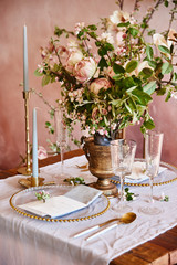 Vintage wedding decor. Beautiful event venue. Creative decoration. Pink and gold color. Wedding calligraphy menu