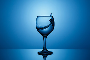 Splash of clear water in a glass