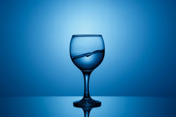 Splash of clear water in a glass