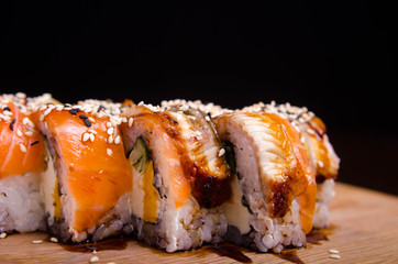 Traditional Japanese cuisine. Sushi restaurant menu. Rolls maki with tuna, eel and avocado.