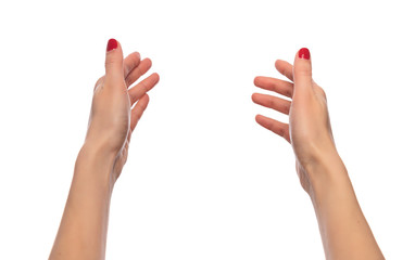 Female hands holding something invisible or pulling hands on white background.