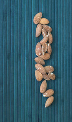 Fototapeta premium Healthy food for background image close up almond nuts. Texture Nuts on top view mock up