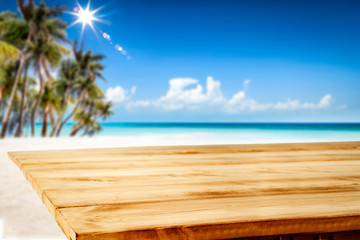 Fototapeta premium Summer table background of free space for your decoration and landscape of beach with palms. 