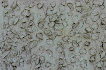 Granite stones protruding from the wall. Texture on the houses of St. Petersburg.