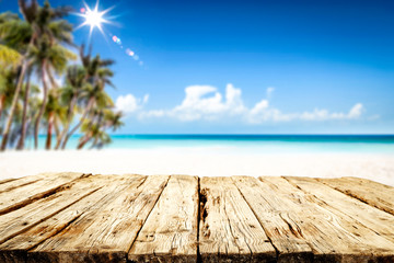 Fototapeta premium Summer table background of free space for your decoration and landscape of beach with palms. 