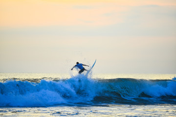 Seeing surfing from the beach before sunset