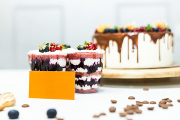 Sweet homemade cake and trifle with jam filling in a glass.