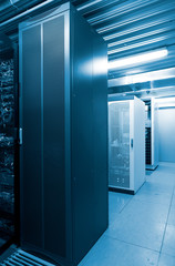 Server cases in datacenter modern server room cold blue tone