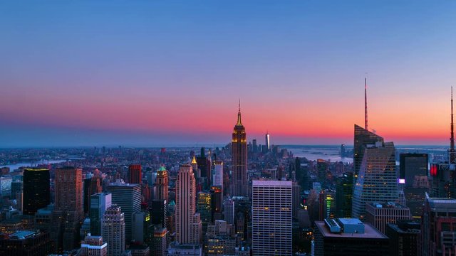 New York, USA. Aerial view on the city skyline in New York City, USA, on a warm sunny summer evening with clear sky. Time-lapse of skyscrapers at sunset