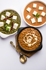 Palak paneer butter masala, yellow dal or dal-makhani served in a bowl in a group. selective focus