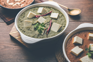 Palak paneer butter masala, yellow dal or dal-makhani served in a bowl in a group. selective focus