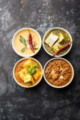 Palak paneer butter masala, yellow dal or dal-makhani served in a bowl in a group. selective focus