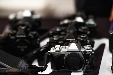 Fototapeta na wymiar Retro-style digital cameras on the table close-up
