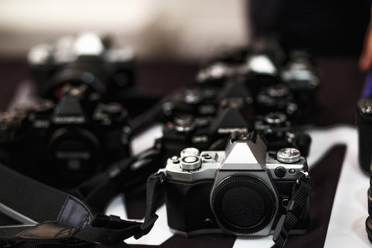 Retro-style digital cameras on the table close-up
