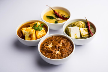 Palak paneer butter masala, yellow dal or dal-makhani served in a bowl in a group. selective focus