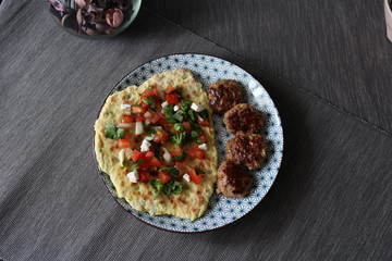 Photo plates with food top view Afghan flatbread with capers, meatballs and Salsa sauce