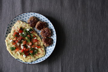 Photo plates with food top view Afghan flatbread with capers, meatballs and Salsa sauce