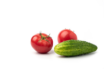 Still life, tomatoes with cucumbers on a white background