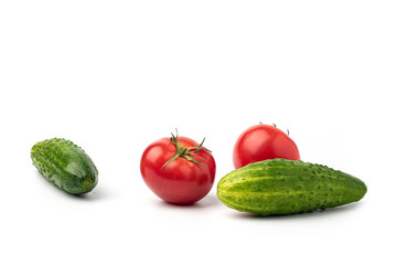 Still life, tomatoes with cucumbers on a white background