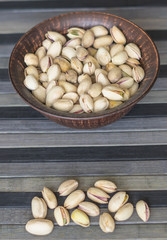 Healthy food  for background image close up pistachios nuts. Texture on top view Nuts pistachio on the cup plate