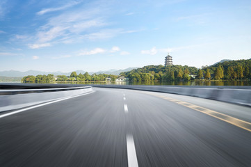 Fototapeta premium Empty road floor surface with modern city landmark buildings of hangzhou bund Skyline,zhejiang,china