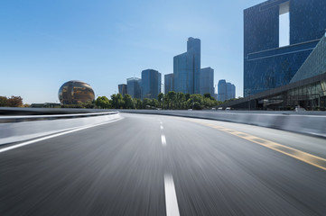 Obraz premium Empty road floor surface with modern city landmark buildings of hangzhou bund Skyline,zhejiang,china