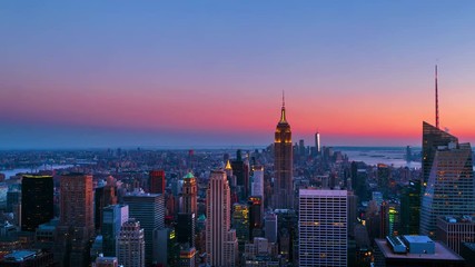 New York, USA. Aerial view on the city skyline in New York City, USA, on a warm sunny summer evening with clear sky. Time-lapse of skyscrapers at sunset, zoom in - Powered by Adobe
