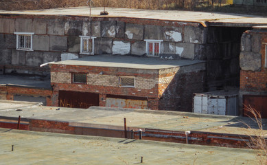Garages with metal gates. Garage cooperative. Old buildings. Ust-Kamenogorsk. Architectural background