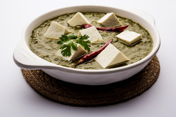 Palak Paneer Curry made up of spinach and cottage cheese served in a bowl. selective focus