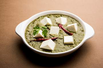 Palak Paneer Curry made up of spinach and cottage cheese served in a bowl. selective focus