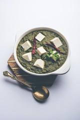 Palak Paneer Curry made up of spinach and cottage cheese served in a bowl. selective focus