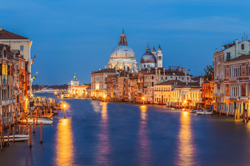 Classic panoramic view of famous Canal Grande with scenic Basilica di Santa Maria della Salute in beautiful golden evening light at sunset with retro vintage filter effect, Venice, Italy - obrazy, fototapety, plakaty