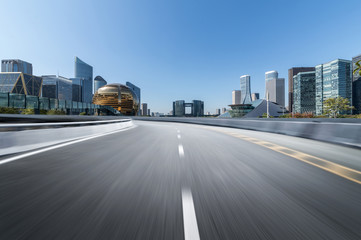 Obraz premium Empty road floor surface with modern city landmark buildings of hangzhou bund Skyline,zhejiang,china