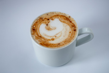 cup of coffee with cream on white background