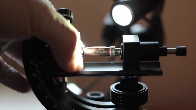 Criminal Police Laboratory, close-up microscopic examination of  bullet, firearms identification, crime investigation, ballistic expertise.