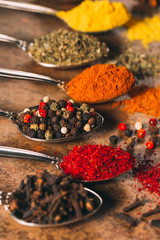 The Different Spices. Spices on stone background.