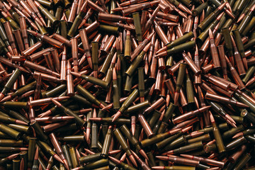 Different ammo on wooden background.