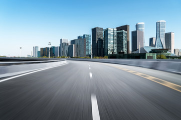 Obraz premium Empty road floor surface with modern city landmark buildings of hangzhou bund Skyline,zhejiang,china