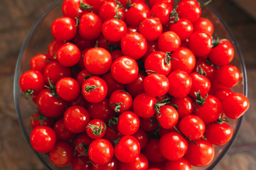 Cherry tomatoes in a transparent plate.