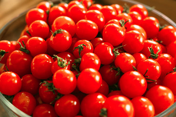 Cherry tomatoes in a transparent plate.