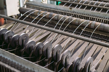 Steel wire metal feeding into bending machine in the industrial factory