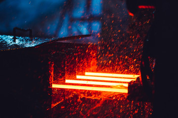 hot steel on conveyor in steel mill