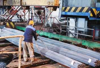 Fototapeta na wymiar building armature are located in the warehouse of metallurgical products. Element of the constructional structure.