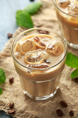 iced latte coffee in a glass with cold milk. Summer drink