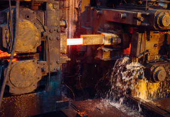 hot steel on conveyor in steel mill