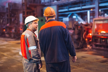 Workers in the steel mill.